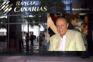 A bank customer tries to use an ATM of Banco Canarias in Caracas